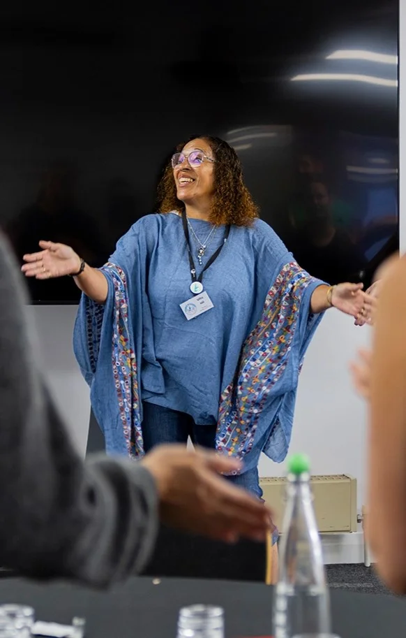 A person delivering a presentation to a group.