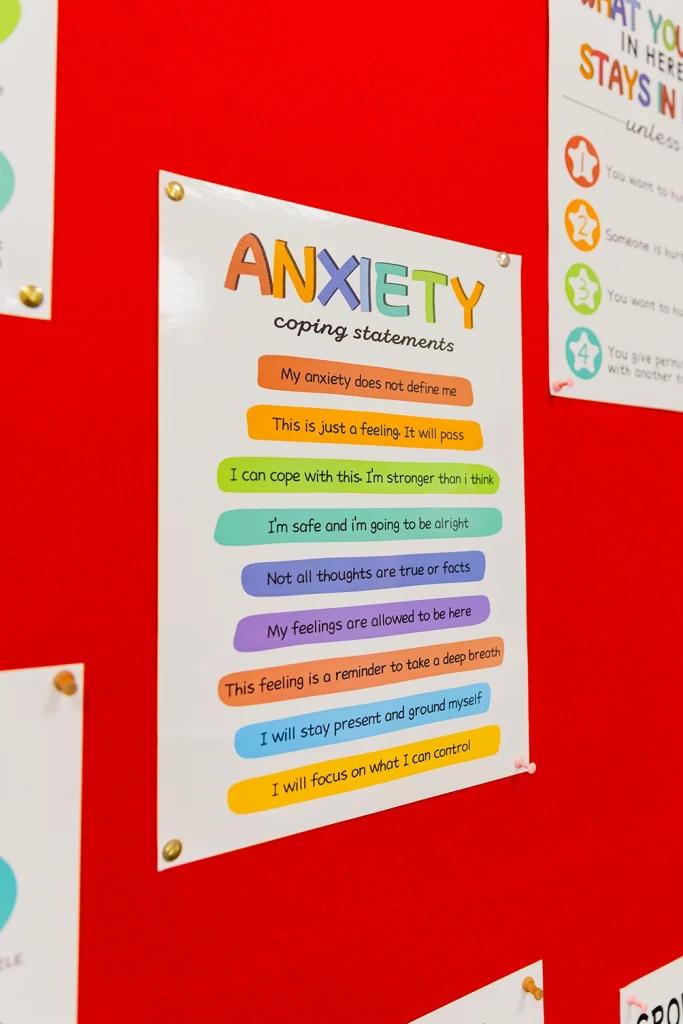 A poster of anxiety coping statements on a notice board.