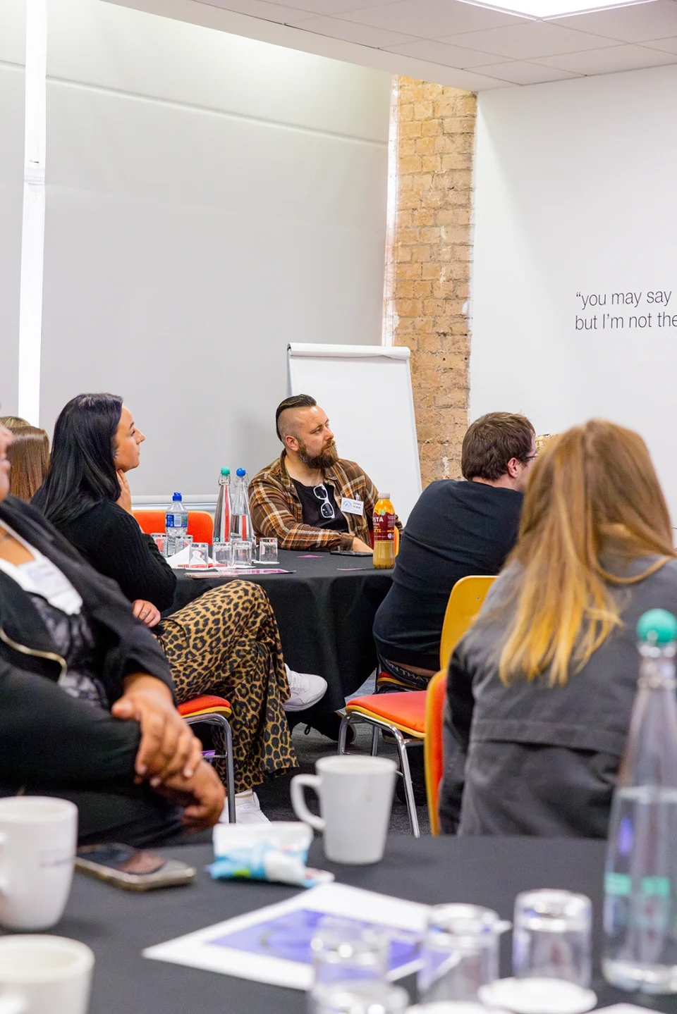 A group of people watching a presentation.
