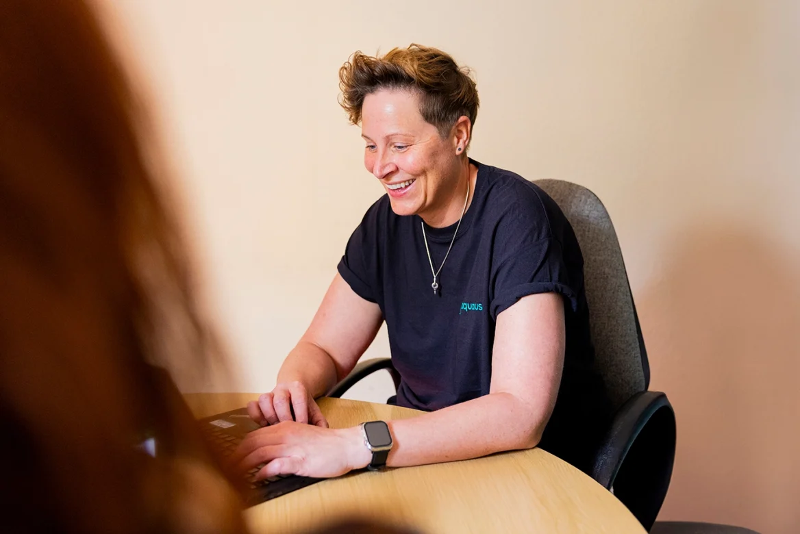 Member of Aquarius staff providing support to a service user.