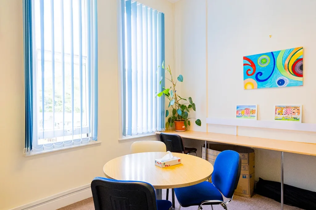 Office desk and chairs in a room.