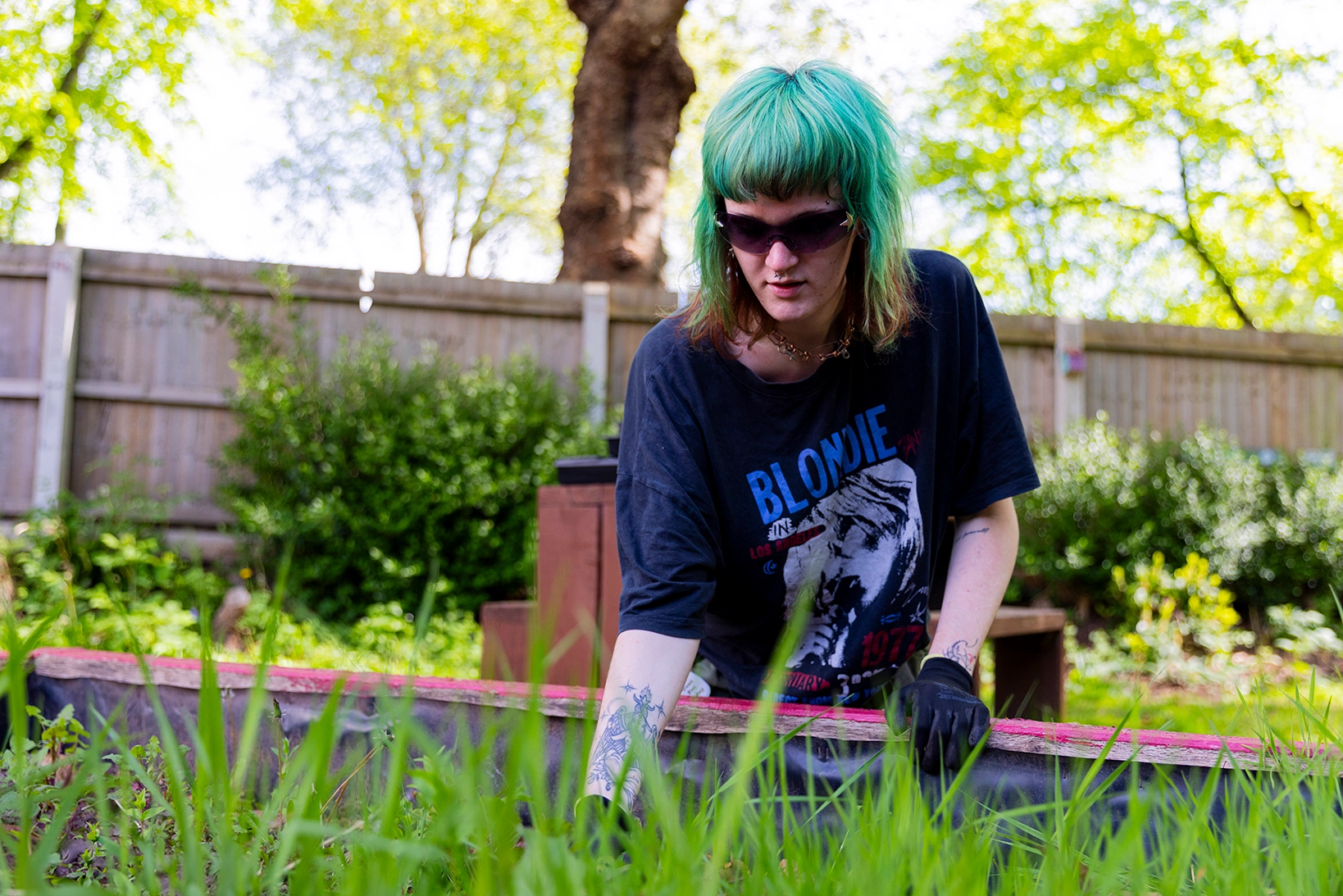A service user tending a planting box.