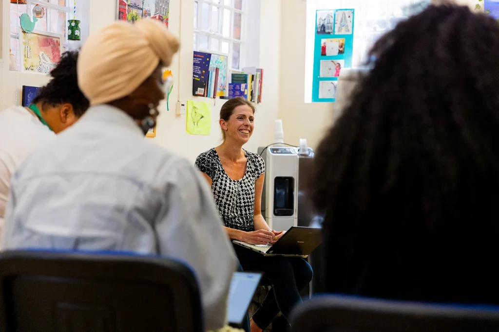 People sat in a circle attending a workshop.